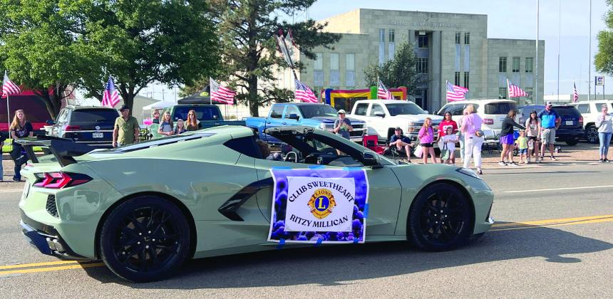 Dimmitt Lions Club Sweetheart Ritzy Millican escorted down Bedford St.