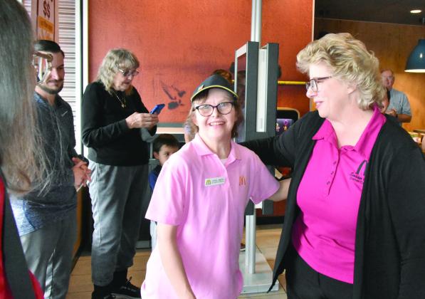 WHAT A SURPRISE--April Smith's face lights up as she realizes that a reception was being held in her honor at the McDonald’s restaurant at 1112 West First recognizing her 30 years of service there. Among those on hand from left are Jake Spears, 'people manager' at the local establishment, April's Mom Taryn Smith, April, and Susan Credle, owner/operator of the two McDonald's in Hereford. (Photo by Jim Steiert)