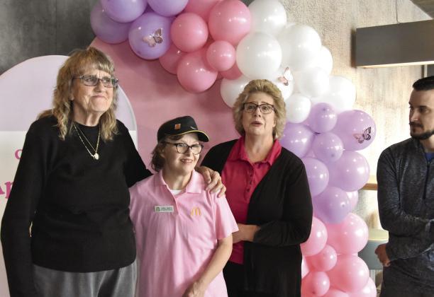 IT'S A FAMILY THING--Taryn Smith joins with her daughter, April, a 30-year employee of McDonald's along with Owner/Operator Susan Credle and Jake Spears. (Photo by Jim Steiert)