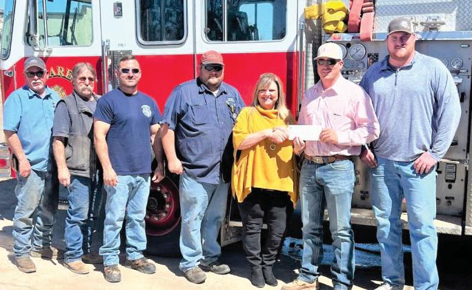 The 100 Club of the Texas Panhandle made a stop at the Nazareth Volunteer Fire Department to visit with and present the VFD with a $15,000 check. The donation to the fire department, as well as several other volunteer fire departments in the Panhandle, was made possible through a hat promotion by Hometown Hats Co. of Lubbock, Lubbock Professional Firefighters Association, and Amarillo Professional Firefighters Local 542, with distribution of funds through the 100 Club.