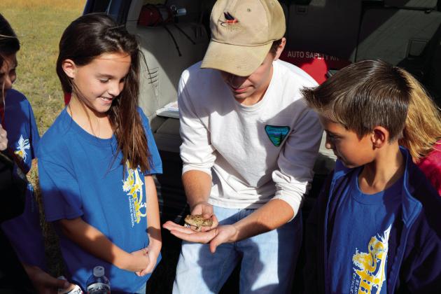 WHAT AN OPPORTUNITY--Curious school kids can learn a ton participating in outdoor adventures where they get to see and even feel fascinating critters and plants. (Photo by Jim Steiert)