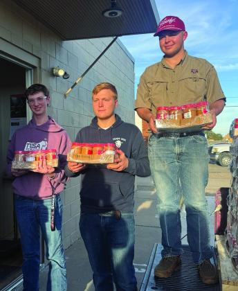 Deaf Smith County 4-H members (from left) Sam Detten, Josef Grotegut and Johan Grotegut chipped in last week to help deliver staples to the Hereford Food Pantry. (Courtesy photo)