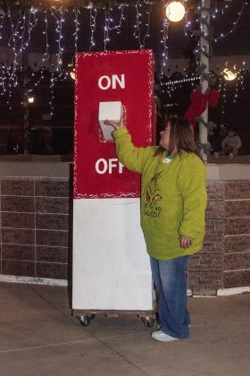 Sherry Thornton turned the power on for the Monument Christmas tree and the snowflake ornaments