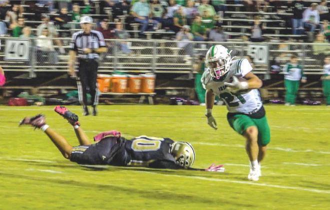 (l-r) #21 Layton Gilbert runs in for an Irish touchdown.