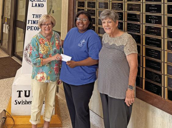 Jeanne Wright and Ka Wilfong with Progressive Study Club presented a donation to Tulia Chamber of Commerce represented by Ja’Nell Wafer