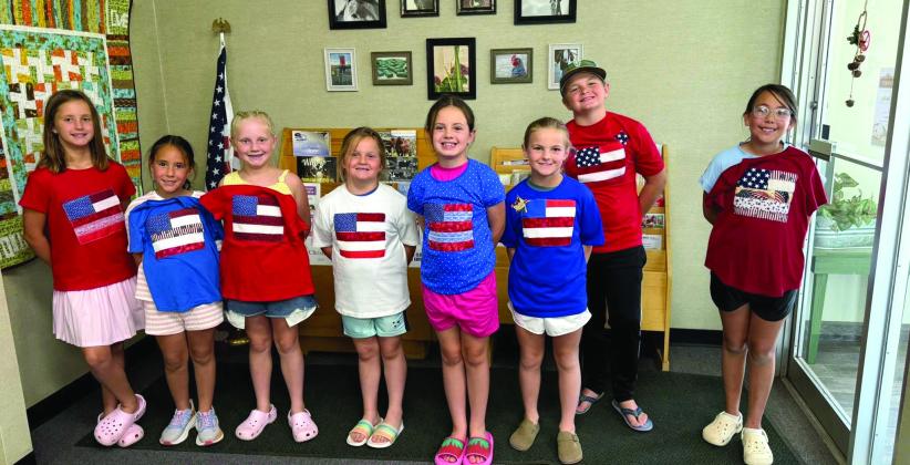 To get ready for the nation's 250th birthday, Castro Coun - ty 4-H made American Flag T-shirts and coasters June 14. The group learned about using fusible to make our flag, sewing on a T-shirt and using a sewing machine to not stitch both sides, strip piecing to make a coaster and us - ing fusible to add stars. (Courtesy photos)