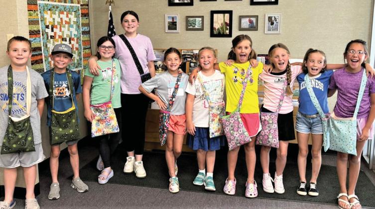 Castro County 4-Hers recently attended a sewing workshop where they made messenger bags. The 10 youth selected fabrics, did the sewing and topstitch and added straps. Parents assisting Extension Agent Felice Acker wereKarenWanjura, Madelyn Kern, Cindy Gerber and extension secretary Missy Kleman.