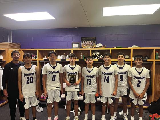 The Dimmitt Varsity Bobcats (above) placed first in the Dimmitt Holiday Basketball Tournament, the Dimmitt JV Bobcats (above, right) placed second in the JV bracket of the tournament.