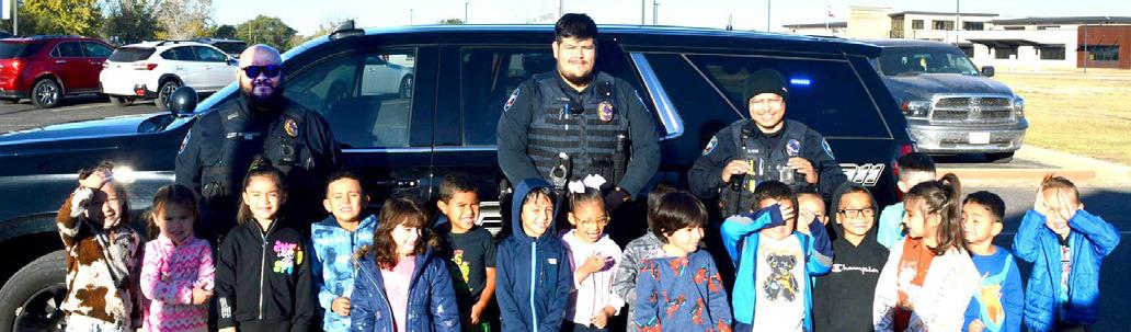 The Dimmitt Police Department took time out of their busy schedules to spend time with the students at Doricell Davis First Steps on Tuesday. Officers visited with children from most of the classes and gave them an up-close view of patrol cars.