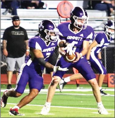 DHS Bobcats quarterback Jack Lunsford hands off the ball for rush by Adrik Bustos. (Dimmitt Sports Media photo)