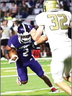 DHS Bobcats Adrik Bustos dodges a Highland Park defensive player on a rush. (Dimmitt Sports Media photo)