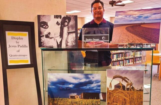 Jesus Padilla of Dimmitt is shown with his photos made in Castro County." Padilla's Display of the Month will be at the library through the end of September.