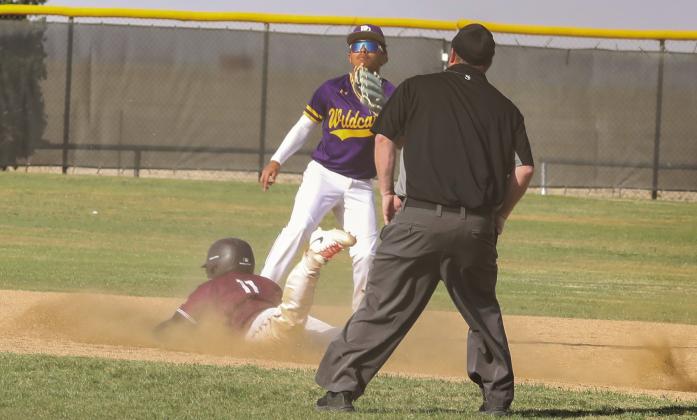 Gustavo Trevino slides in safe at 2nd base