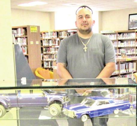 January Display of the Month is Sam Cavazos with remote control 1964 Chevy Impalas and F450 pickups.