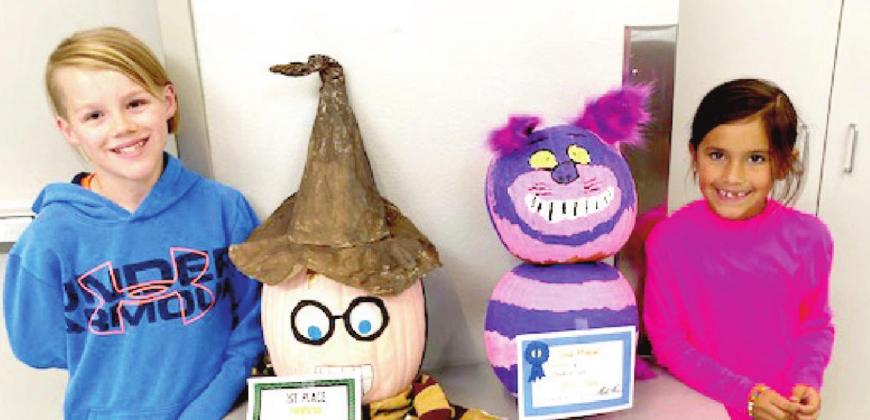 (Photo Left) RES Pumpkin Contest Winners - Third Grade: Griffin Neinst, 1st place; Kennedy Clareman, 2nd place.