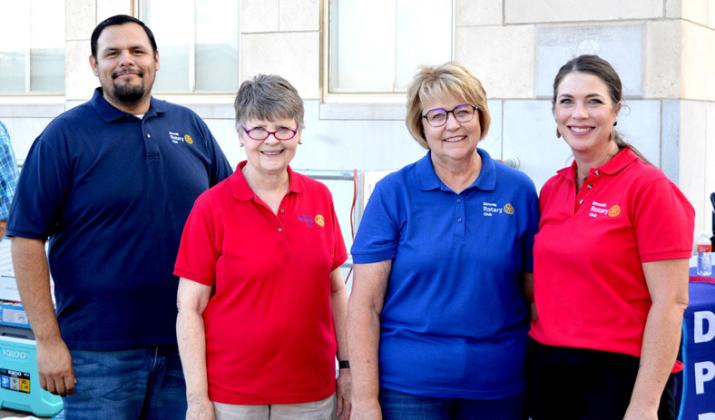 The Rotary Club pitched in with city and county officials serving burgers.