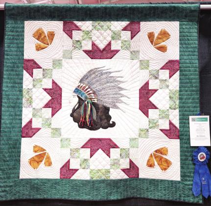(Photo left) Ogallala Quilt Festival - Miss Oklahoma – First Place - Made and quilted by Vicki Cooper and Leslie Cutright, Lubbock.