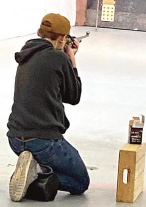 (Photo right) Castro County 4-H Miles Nelson competing at the District 2 Rifle Contest.