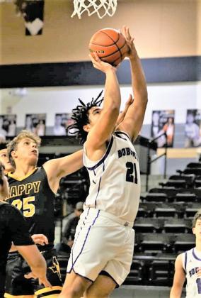 Bobcats Gaquoire Chatham moves in for a shot against Happy at the Vega tournament. (Dimmitt Sports Media photo)