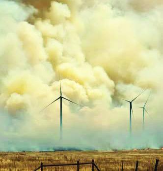 ROILING PLUMES--Acrid smoke arises from wildfire amidst wind turbines in pasture country along FM 168 south of the Buffalo Lake National Wildlife Refuge. Smoke plumes could be seen almost to Lubbock.