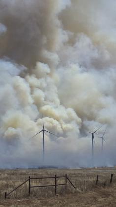 ROILING PLUMES--Acrid smoke arises from wildfire amidst wind turbines in pasture country along FM 168 south of the Buffalo Lake National Wildlife Refuge. Smoke plumes could be seen almost to Lubbock.