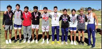 (Photo left) The DHS XC varsity girls claimed a third place overall at the 3A District Meet in Lubbock on Tuesday. (Photo below) The DHS XC varsity boys were the top team at the 3A District Meet in Lubbock, placing runners in four of the top positions and Azariah Gonzalez winning the 3 mile run.