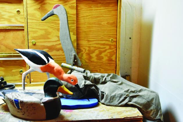 CRAFTSMANSHIP AND SKILL--The crafting of carved decoys to lure wildfowl is an ancient skill held in respect by many waterfowling enthusiasts. Pieces of pine, cedar, and other woods can be transformed with careful strokes of sharp tools and an eye for detail. (Photo by Jim Steiert)