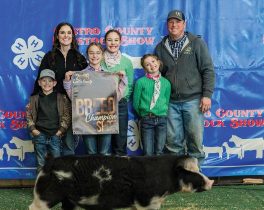 Brooklyn Kleman is pictured with her Breed Champion Spot.
