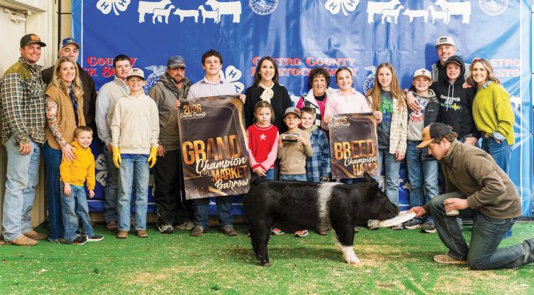 Copper Farris is pictured with his Grand Champion Market Barrow at this year's Castro County Junior Livestock Show.