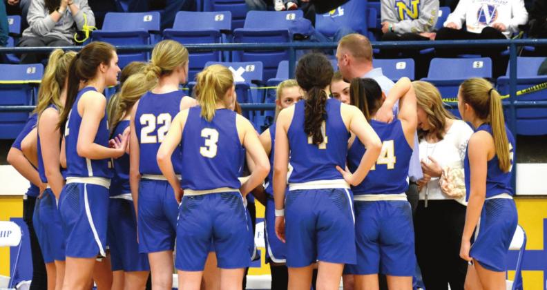 Coach Eric Schilling and the Swiftettes prepare to take the court in the state semifinals game.