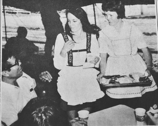 APPETIZERS BEFORE THE FEAST--Clad in classic German folk attire lovely Nazareth ladies carry trays of appetizers for folks waiting to enter the Nazareth Community Hall for the big German Festival dinner in Nazareth in this photo from an August 1974 issue of the Castro County News. The Festival was held on Sundays in its initial years.