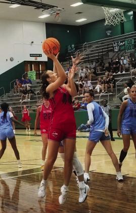 Nazareth’s Kambri Cleavinger played in the Texas Girls Coaches Association All-Star Game Friday, July 17. Left, Cleavinger (44) is pictured with Riley Segura (1) of Panhandle and Joie Read (40) of Dalhart. Top, right, Kambri receives the patch the players get for being an All-Star, with her coach right behind her. Also pictured is the Cleavinger’s team as well as Cleavinger playing in the contest. (Courtesy photos)