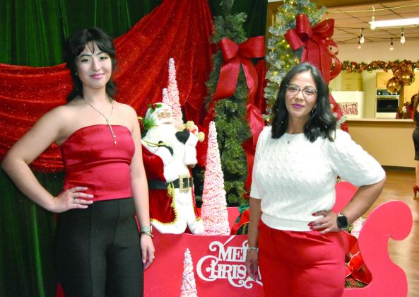 READY TO SLEIGH—Anahi Gonzales and Vanessa Nava, executive director of the Hereford Senior Citizens Association, hope for a ride with Santa at the Festival of Trees. (Photos by Jim Steiert)