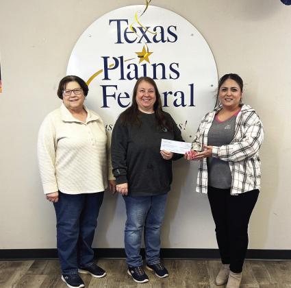 Becky Tucker and Debbie Bales receiving donation from April Garza, Branch Manager Texas Plains FCU, Tulia, Texas