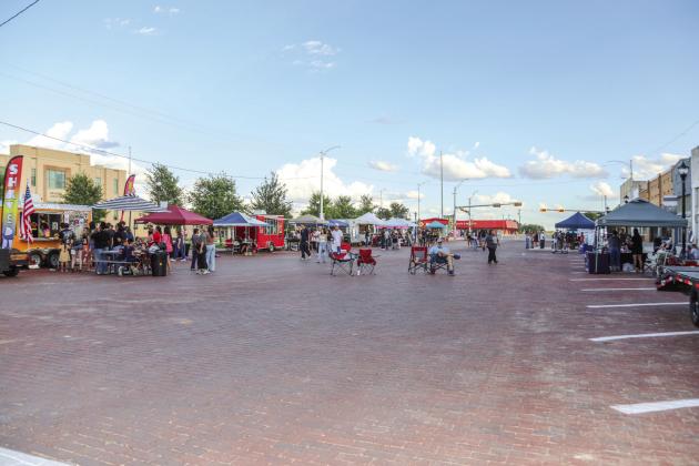 Crowds enjoy the food and game booths