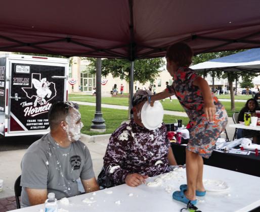 Deputy Jack and Sheriff Schmalzried spent some time in the Tulia Athletic Booster Club Pie in the Face booth