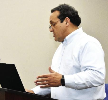 FINALLY HERE--Juan Santana of Hankins Eastup finally caught a flight to the Panhandle and presented the 2022-2023 audit report to the city during the November 17 City Commission meeting. Santana offered a nudge to the city for more timely audits, given a lag in that area in recent fiscal years. (Photo by Jim Steiert)