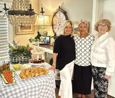 La Madre Mia held their March 26 meeting at Sandy Josserand’s home. Pictured (left to right) are Sandy Josserand and co-hostesses Judy Williams and Carolyn Baxter. (Photo By Angela Blackmon)