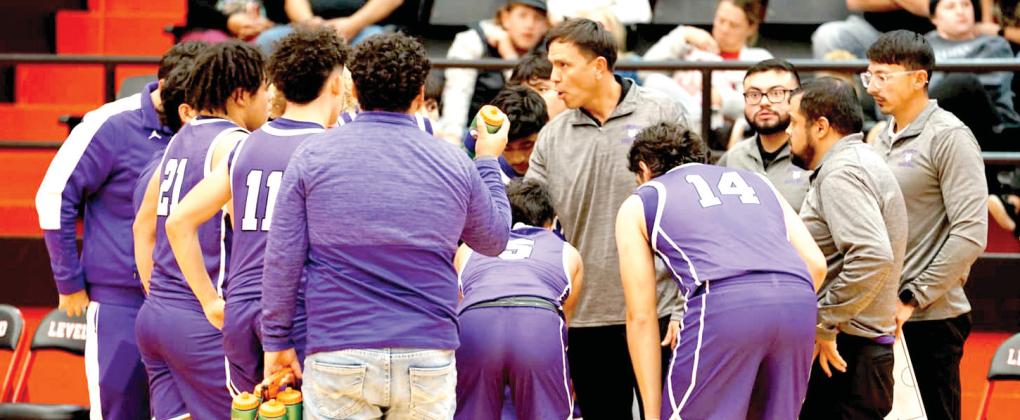 Coach Nicholas Guana gives instructions to his Bobcats during a timeout in the Levelland game. (Dimmitt