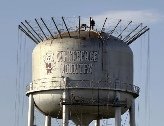 The Hereford Water Tower located on Moreman Street close to Whiteface Field continues to undergo maintenance. Several months ago, the City of Hereford decided to fix leaks and other internal issues the water tower was having along with repainting the structure. Top, the water tower was draped this week as renovations continue for the project. (BRAND photos/Bryan Hedrick)