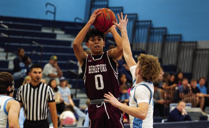 Pierce Valdez (0) plays against West Plains. The Whitefaces lost 72-41 to Estacado in the Caprock Tournament Monday. Both the Lady Herd and the Hostile Herd host Pampa Jan. 6 in district play.