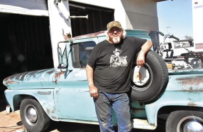 STILL ROAD WORTHY--Mike Harrell and his classic 1960 Chevy pickup are both still road worthy and will likely share some traveling adventures after Harrell closes a local institution--Mike's Auto Repair at the end of April. He rebuilt the pickup's motor and added an air conditioner that he installed himself. He's already driven the rig as far as Houston and back. (Photo by Jim Steiert)