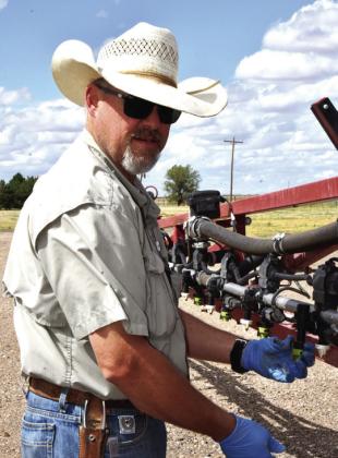 RELYING ON SUMMER FALLOW--Michael Carlson near Milo Center adjacent to the 385 Corridor where aquifer depletion is heavy. He says declining well flow has necessitated adjustment. “We’re planting fewer acres and closely managing the efficiency of what we do plant. I rely on summer fallow ground now.' (Photo by Jim Steiert)