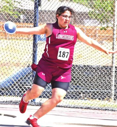 (Photo right) HHS freshman Mia Lopez competed in the discus throw at the Regional track meet.