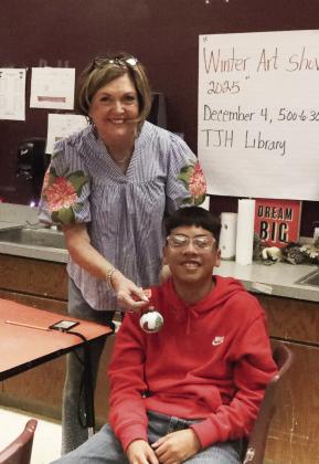 Elias Cedillo won an ornament in a drawing from Mrs. Herring