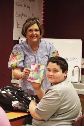 Braden Prize won a piece of art in a drawing from Mrs. Herring