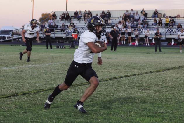 Mason Wolf makes the reception and advances the ball