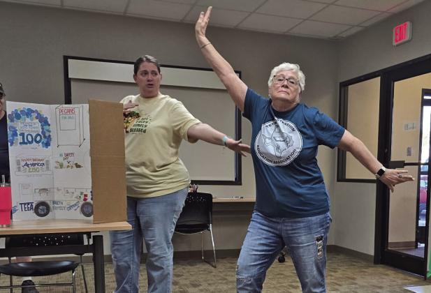 Anna Leatherman presenting the TEEA t-shirt modeled by Nancy Bonds