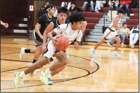 Deshaun Yarbrough takes the ball down the court