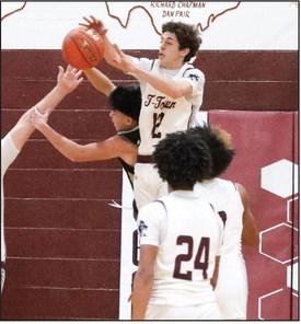 Easton Mahannah jumps high to block the shot